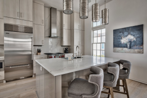 Alys Beach house kitchen counter seating with fun lighting