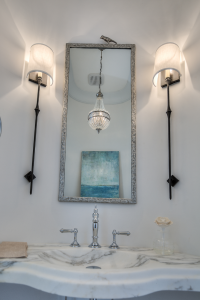 30A beach house bathroom with silver bird mirror