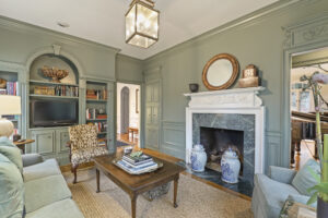 Buckhead Atlanta Den with elegant lighting feature