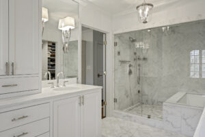 Frameless shower and sleek lighting in Buckhead Atlanta master bathroom.